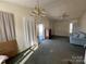 Living room with carpet, a ceiling fan, and a view of the front yard at 1004 Johnson St, Charlotte, NC 28206