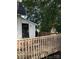 Home features a wooden deck with railings, offering outdoor space at 1019 W 5Th Ave, Gastonia, NC 28052