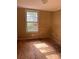 Needs renovation. Features a large window and wood flooring at 1019 W 5Th Ave, Gastonia, NC 28052