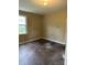 Simple bedroom with hardwood floors and a window at 1019 W 5Th Ave, Gastonia, NC 28052