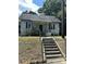 Charming one-story house with a covered porch and a fenced yard at 1019 W 5Th Ave, Gastonia, NC 28052