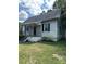 White siding house with a spacious yard needing some landscaping at 1019 W 5Th Ave, Gastonia, NC 28052