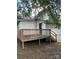 White house exterior with wooden deck and steps at 1019 W 5Th Ave, Gastonia, NC 28052