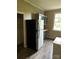 Kitchen features stainless steel refrigerator and gray cabinets at 1019 W 5Th Ave, Gastonia, NC 28052