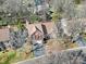 An aerial view showcases the home's well-manicured landscaping and tree-lined streets at 10433 Pullengreen Dr, Charlotte, NC 28277