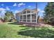 A brick foundation and airy architecture define the porch in this well-kept backyard at 10433 Pullengreen Dr, Charlotte, NC 28277