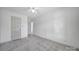 Spacious bedroom with neutral colors, and two entry doors at 10433 Pullengreen Dr, Charlotte, NC 28277