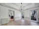 Bright room with hardwood floors, crown molding, and multiple windows for an abundance of light at 10433 Pullengreen Dr, Charlotte, NC 28277