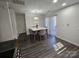 A bright kitchen featuring stainless steel appliances and a dining area with a modern marble table at 10904 Pimlico Dr, Charlotte, NC 28273