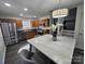 An inviting kitchen with stainless steel appliances and a stylish, modern dining table at 10904 Pimlico Dr, Charlotte, NC 28273