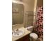 Functional bathroom featuring a neutral color scheme, mirrored vanity, and shower with patterned curtain at 11306 Kingfisher Dr, Charlotte, NC 28226