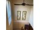 Upstairs landing with ceiling fan and wall art at 11306 Kingfisher Dr, Charlotte, NC 28226