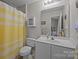 Clean bathroom with shower, toilet, and vanity at 12250 Savannah Garden Dr, Charlotte, NC 28273