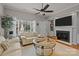 Comfortable living room featuring a fireplace, neutral decor, and hardwood floors at 12250 Savannah Garden Dr, Charlotte, NC 28273