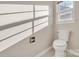 Bathroom featuring white toilet, window with lots of natural light at 12527 Cedar Post Ln, Charlotte, NC 28215