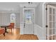 Bright foyer with a decorative glass door, hardwood floors, and neutral walls at 12527 Cedar Post Ln, Charlotte, NC 28215