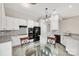 Bright kitchen with white cabinets, marble countertops, and modern appliances at 12527 Cedar Post Ln, Charlotte, NC 28215