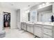 Bright bathroom with double vanity sinks, and a walk in closet at 1328 Lena St, Monroe, NC 28112