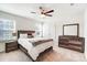 Bedroom with a large bed, dresser, and neutral color scheme at 1328 Lena St, Monroe, NC 28112