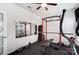 Home gym with a mirror, weightlifting equipment, and a ceiling fan, designed for fitness and exercise at 1328 Lena St, Monroe, NC 28112