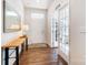 Entryway showcasing wood floors, a console table, a mirror, and a glass-paneled door at 1328 Lena St, Monroe, NC 28112