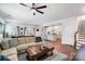 Open-concept living room flowing into the kitchen, featuring hardwood floors and modern finishes at 1328 Lena St, Monroe, NC 28112