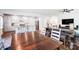 Open-concept living space featuring hardwood floors, a modern kitchen, and a dining area at 1328 Lena St, Monroe, NC 28112