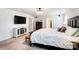 Bright bedroom with a large bed, television, and neutral color scheme at 1328 Lena St, Monroe, NC 28112