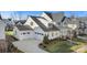 Aerial view of house and neighborhood, showcasing landscaping and community at 13308 Oak Farm Ln, Huntersville, NC 28078