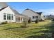 Landscaped backyard with multiple homes visible at 13308 Oak Farm Ln, Huntersville, NC 28078