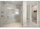 Elegant bathroom with a large walk-in shower, toilet, and heated towel rack at 13308 Oak Farm Ln, Huntersville, NC 28078