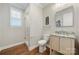 Clean bathroom with a shower, toilet and granite vanity at 13308 Oak Farm Ln, Huntersville, NC 28078