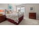 Charming bedroom with ornate bed frame and window at 13308 Oak Farm Ln, Huntersville, NC 28078