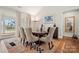 Bright dining area with hardwood floors and large windows at 13308 Oak Farm Ln, Huntersville, NC 28078