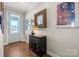 Entryway with hardwood floors, console table, and wall art at 13308 Oak Farm Ln, Huntersville, NC 28078