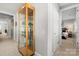 Hallway with a display cabinet and bedroom view at 13308 Oak Farm Ln, Huntersville, NC 28078