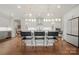 Bright kitchen boasts an island and seating for four at 13308 Oak Farm Ln, Huntersville, NC 28078