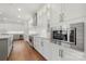 Modern kitchen features stainless steel appliances and white cabinets at 13308 Oak Farm Ln, Huntersville, NC 28078