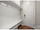 Functional mudroom with built-in bench and storage at 13308 Oak Farm Ln, Huntersville, NC 28078