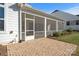 Screened porch with brick patio and white exterior at 13308 Oak Farm Ln, Huntersville, NC 28078