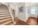 Stunning wooden staircase leading to upper level at 13308 Oak Farm Ln, Huntersville, NC 28078