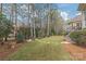 Landscaped backyard with stepping stones and privacy at 15214 Mccomb Manor Ct, Charlotte, NC 28277