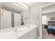 Double vanity bathroom with a view into a bedroom at 15214 Mccomb Manor Ct, Charlotte, NC 28277