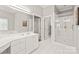 Bathroom with double vanity, shower and access to other rooms at 15214 Mccomb Manor Ct, Charlotte, NC 28277