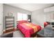 Bright bedroom with a comfortable bed and built-in shelving at 15214 Mccomb Manor Ct, Charlotte, NC 28277