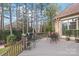 Deck with outdoor furniture and wooded backdrop at 15214 Mccomb Manor Ct, Charlotte, NC 28277