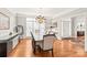 Elegant dining room with hardwood floors and access to the foyer at 15214 Mccomb Manor Ct, Charlotte, NC 28277