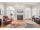 Bright living room with hardwood floors and fireplace at 15214 Mccomb Manor Ct, Charlotte, NC 28277