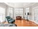 Sitting area with large windows and hardwood floors at 15214 Mccomb Manor Ct, Charlotte, NC 28277