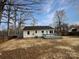 Home features a deck and spacious backyard with storage shed at 165 Bowman Rd, Statesville, NC 28625